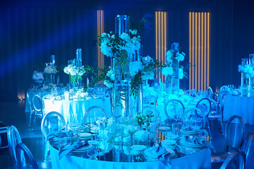Table setup in blue light. Ready to event.