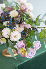 Beautiful flower wedding composition with roses on a table