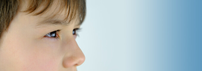 close-up of part of the child's face, boy 10-12 years old, sad, anxious face of teenager, difficult...