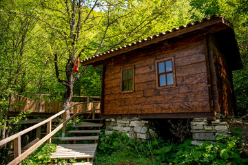 Fototapeta na wymiar A wooden hut in Erfelek waterfalls national park, Sinop, Turkey 
