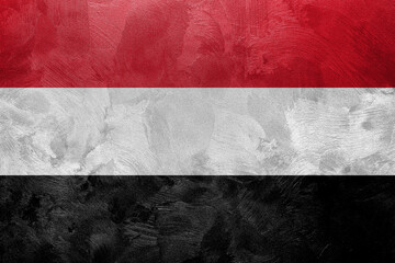 Textured photo of the flag of Yemen.
