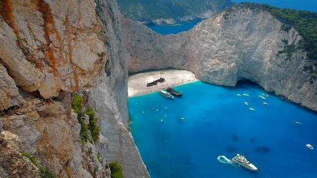 Aerial panorama reveal of Amazing Navagio Beach in Zakynthos Island with Ship Wreck beach and Navagio bay visible. The most famous natural landmark of Zakynthos, Greek island in the Ionian Sea.