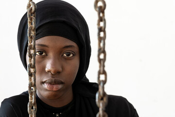 Disheartened sad African young girl concerned about her destiny. Forced marriage, rights denied and...