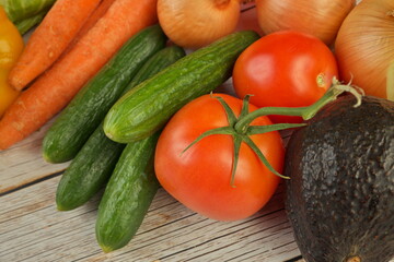 High Angle View of Selection of Fresh Summer Vegetables on a Rustic Wooden Table