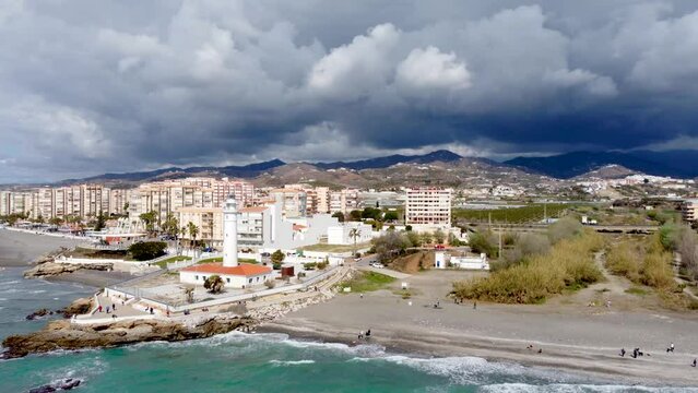 Torrox Costa view from above. Drone footage of this costal city situated in Malaga province, Costa del Sol - Spain. Touristic travel destination. Drone pan left.