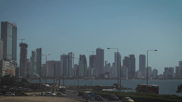 Timelapse of the city of Cartagena, skyline of Colombian city close to water, looking down from the city fortress on a sunny day