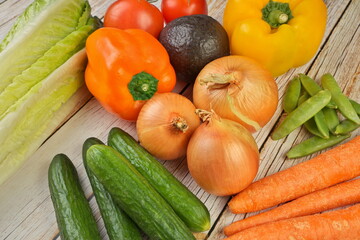 High Angle View of Selection of Fresh Summer Vegetables on a Rustic Wooden Table
