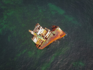 sunken ship, grounded transport ship, rusty skeleton of ship