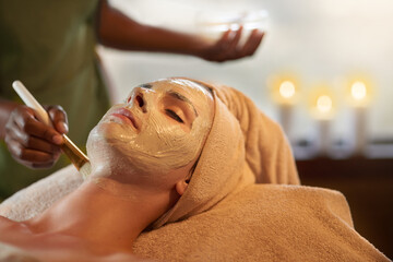 Only the best for perfect skin. Shot of a young woman receiving a beauty treatment in a spa.