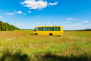 Yellow school bus in the field