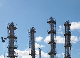 tall steel fractionation or cooling towers at a large industrial chemical plant