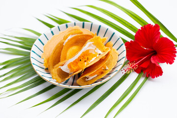 Thai crispy pancakes on white background.