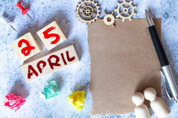 April 25th. International Day Of DNA. Image of april 25 wooden color calendar on blue background.