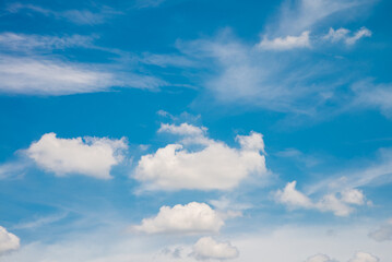 White clouds and blue sky background in sunshine day - Save the earth concept.