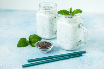 Tasty yogurt or smoothie with chia and mint, vegetarian food