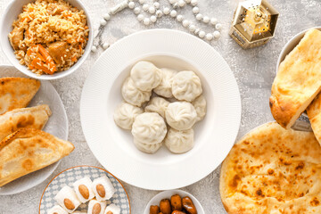 Traditional Eastern dishes on grunge background, top view