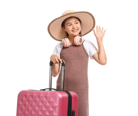 Cute little girl with suitcase and headphones on white background