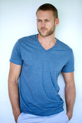 Simple style speaks the loudest. Studio shot of a handsome young man posing against a white...