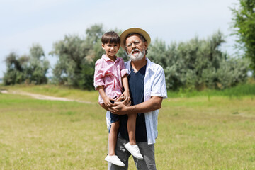 Little boy with his grandfather outdoors