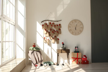 Modern room interior with stylish advent calendar and Christmas decor