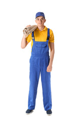 Male worker with rolled carpet on white background