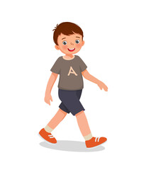 cute little boy walking on the road