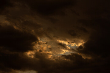 Cloudscape. Dramatic sunset sky and clouds with beautiful red, black, yellow and orange colors.