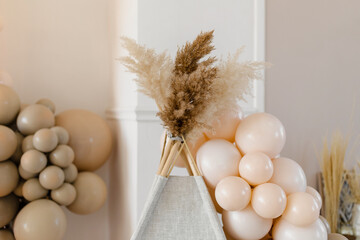 Event decoration in boho style. Beige balls. Children's wigwam. © Антон Романюк
