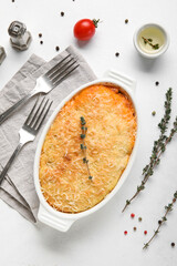 Baking dish with tasty Shepherd's pie on white background