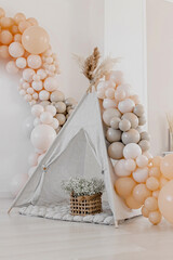 Event decoration in boho style. Beige balls. Children's wigwam. © Антон Романюк