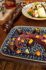 octopus cleaned of its entrails and cooked whole for some time (preferably in a copper pot) in order to soften its meat