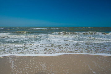 Fototapeta na wymiar White Waves On Beach Naples Florida