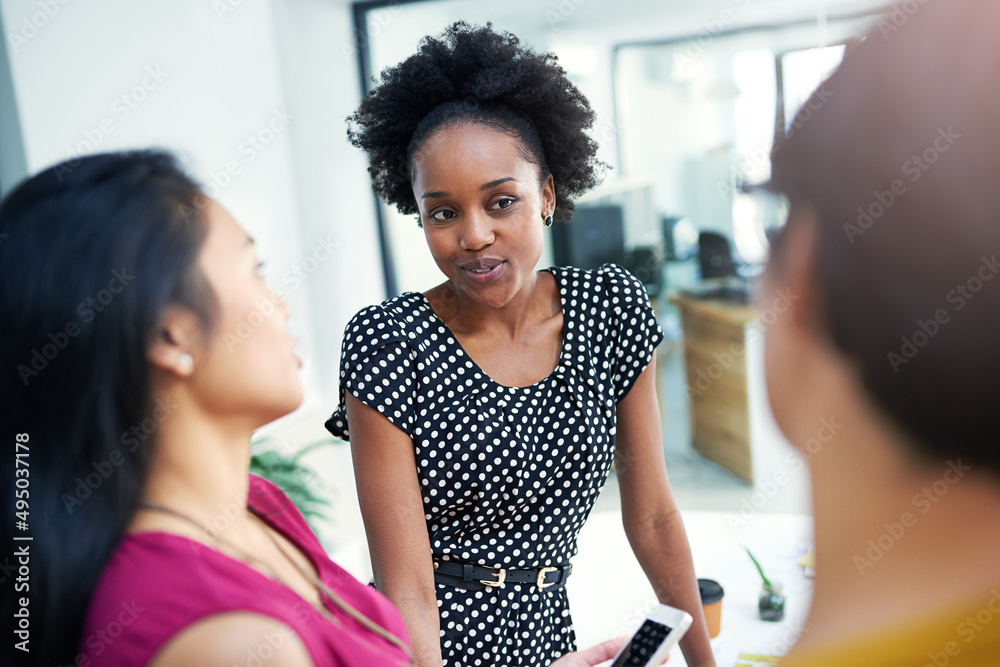 Wall mural Colleagues in creativity. Cropped shot of three businesswomen meeting in the boardroom.