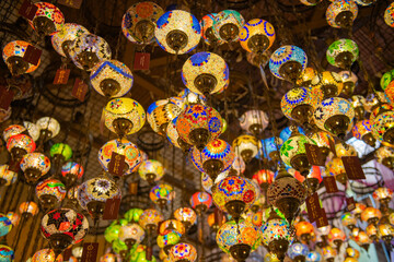 bright colored multi-colored lanterns hang on the ceiling