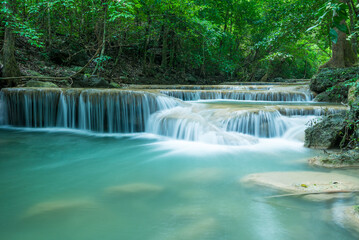 Beautiful Erawan tropical waterfall in Kanchanaburi province, Thailand. Travel in nature concept.