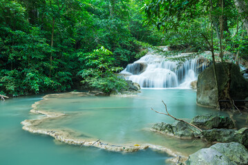 Beautiful Erawan tropical waterfall in Kanchanaburi province, Thailand. Travel in tropical forest concept.