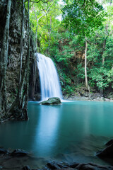 Beautiful Erawan tropical waterfall in Kanchanaburi province, Thailand. Travel in nature concept.