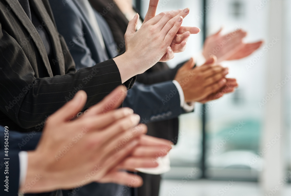 Poster Great presentation are motivational. Closeup shot of a group of executives clapping while standing in a row in an office.