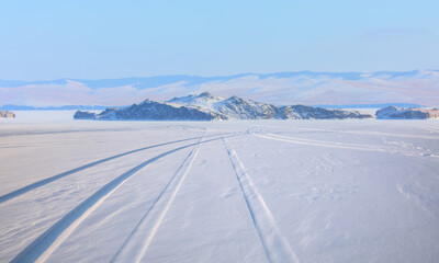 Car tire tracks (trail) in fresh snow - Baikal Lake, Siberia 