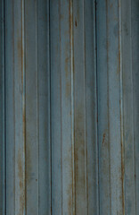 Obraz premium Vertical rusted corrugated metal surface texture