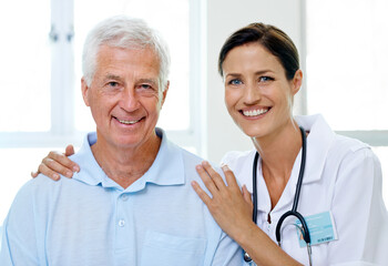 Hes safe in her hands. Portrait of a beautiful young doctor and her senior patient.