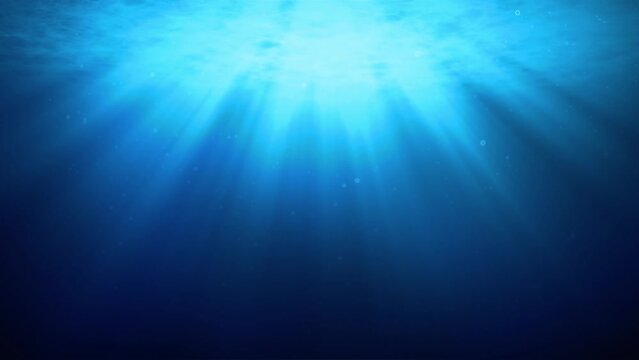 Deep Ocean Sun Rays Underwater Scene . Light rays shining through water surface to the dark depth of Ocean button. Wide View 4k Video 