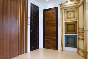 the door in the house with a beautiful handle. it's nice to open and close the door. modern design, expensive and beautiful door fittings