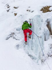 Rescuers climbers in training in the mountains in winter.
