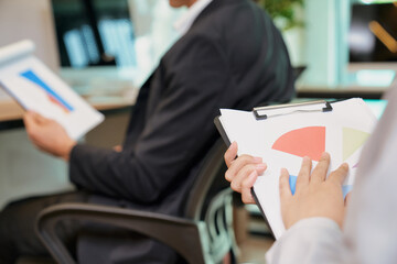 Working office place with paper document in businessteam hand