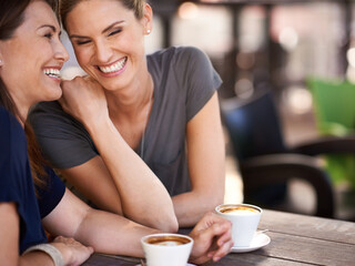 And then you wont believe what he said. Cropped shot of two attractive women laughing while...