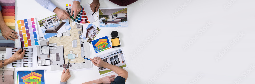 Poster designers working on color selection for house