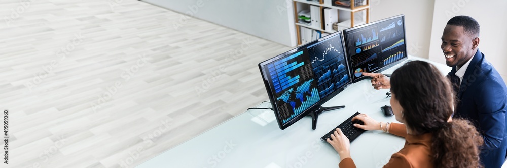 Poster Two Businesspeople Examining Graph On Computer