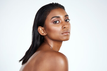 Shes a cover girl for that natural dewy skinned look. Studio shot of a beautiful young woman posing...