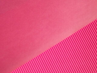 Background surface made of red, crimson pape rwith diagonal stripes